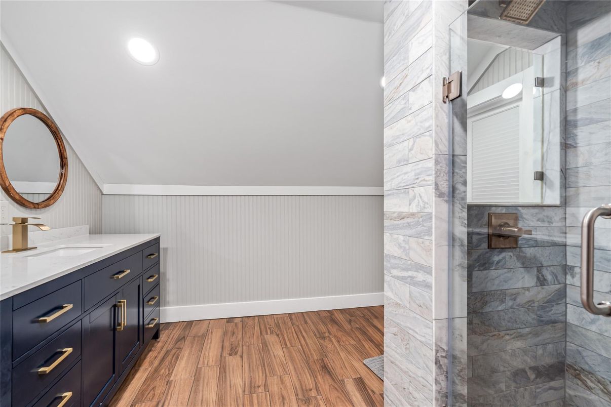 Bathroom, Glass Shower, Interior, Marble Walls, Recessed Lighting, Wood Texture Flooring