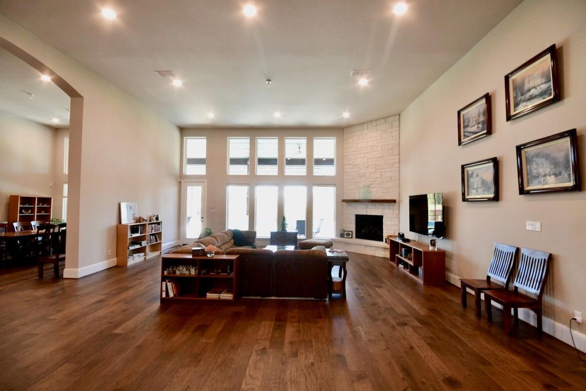 Fireplace, Interior, Living room, Recessed Lighting, Stone Walls, Wood Texture Flooring