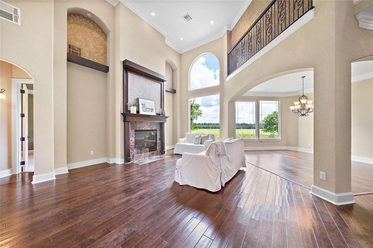 Chandelier, Fireplace, Interior, Living room, Recessed Lighting, Wood Texture Flooring