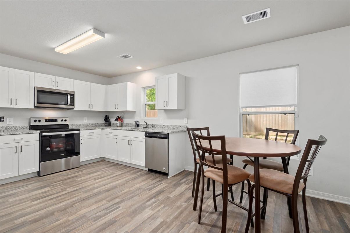 Dining room, Interior, Kitchen, Recessed Lighting, Stainless Steel Appliances, Wood Texture Flooring