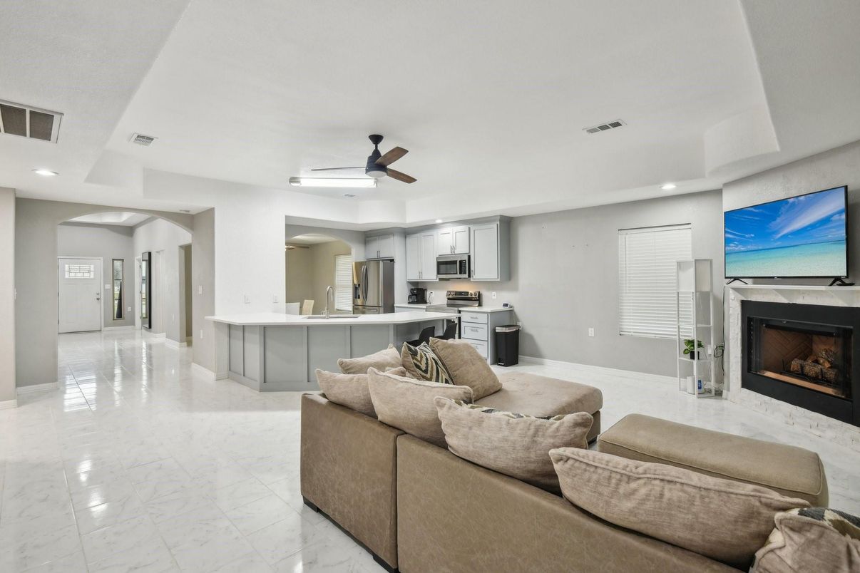 Fireplace, Interior, Kitchen, Living room, Marble, Recessed Lighting, Stainless Steel Appliances