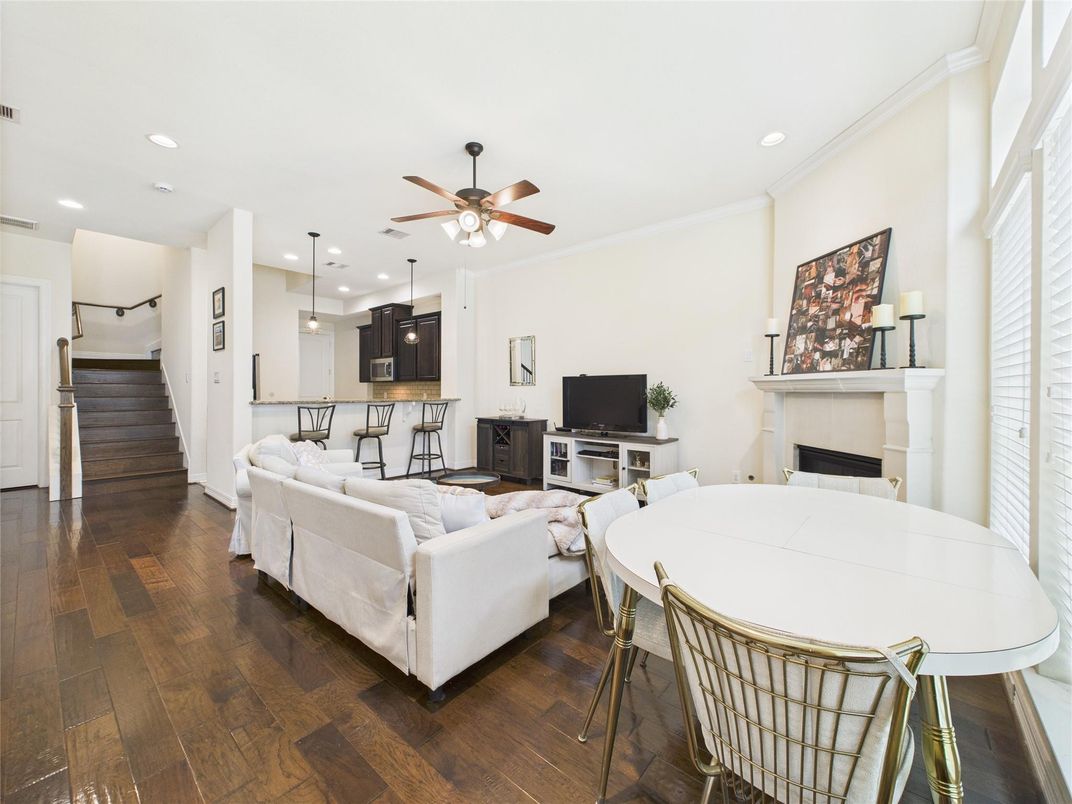 Dining room, Fireplace, Interior, Living room, Pendant Lights, Recessed Lighting, Wood Texture Flooring