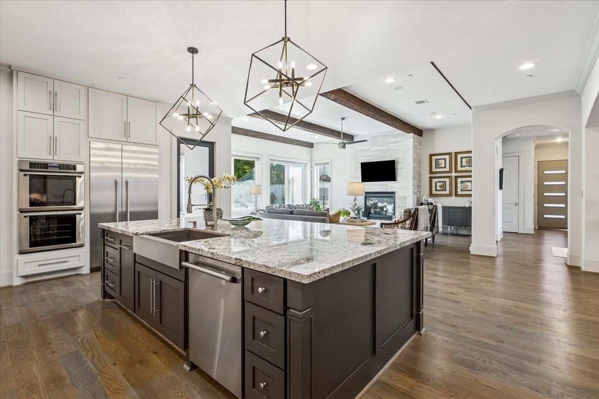 Fireplace, Interior, Kitchen, Pendant Lights, Recessed Lighting, Stainless Steel Appliances, Stone Walls, Wooden Beams, Wood Texture Flooring