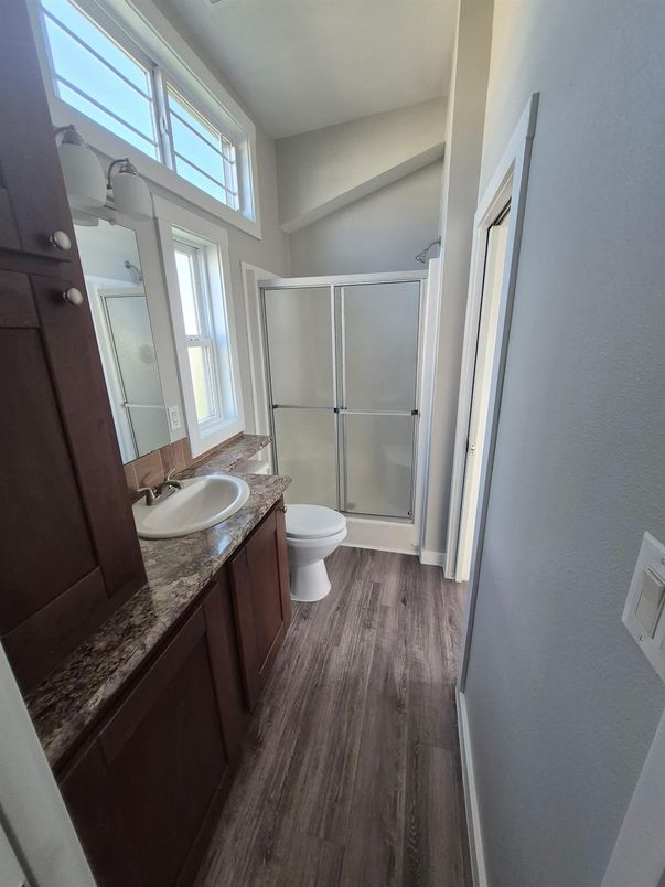 Bathroom, Dual Sink Vanities, Glass Shower, Interior, Wood Texture Flooring