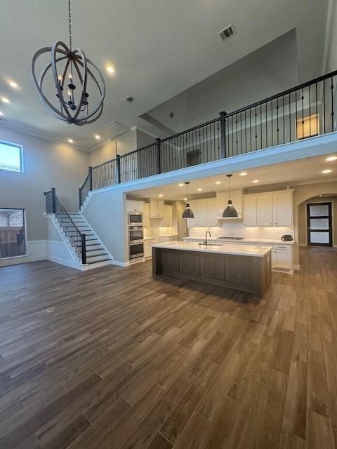 Chandelier, Interior, Kitchen, Pendant Lights, Recessed Lighting, Stainless Steel Appliances, Wood Texture Flooring