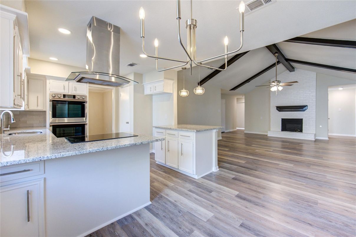 Fireplace, Interior, Kitchen, Pendant Lights, Recessed Lighting, Stainless Steel Appliances, Wood Texture Flooring