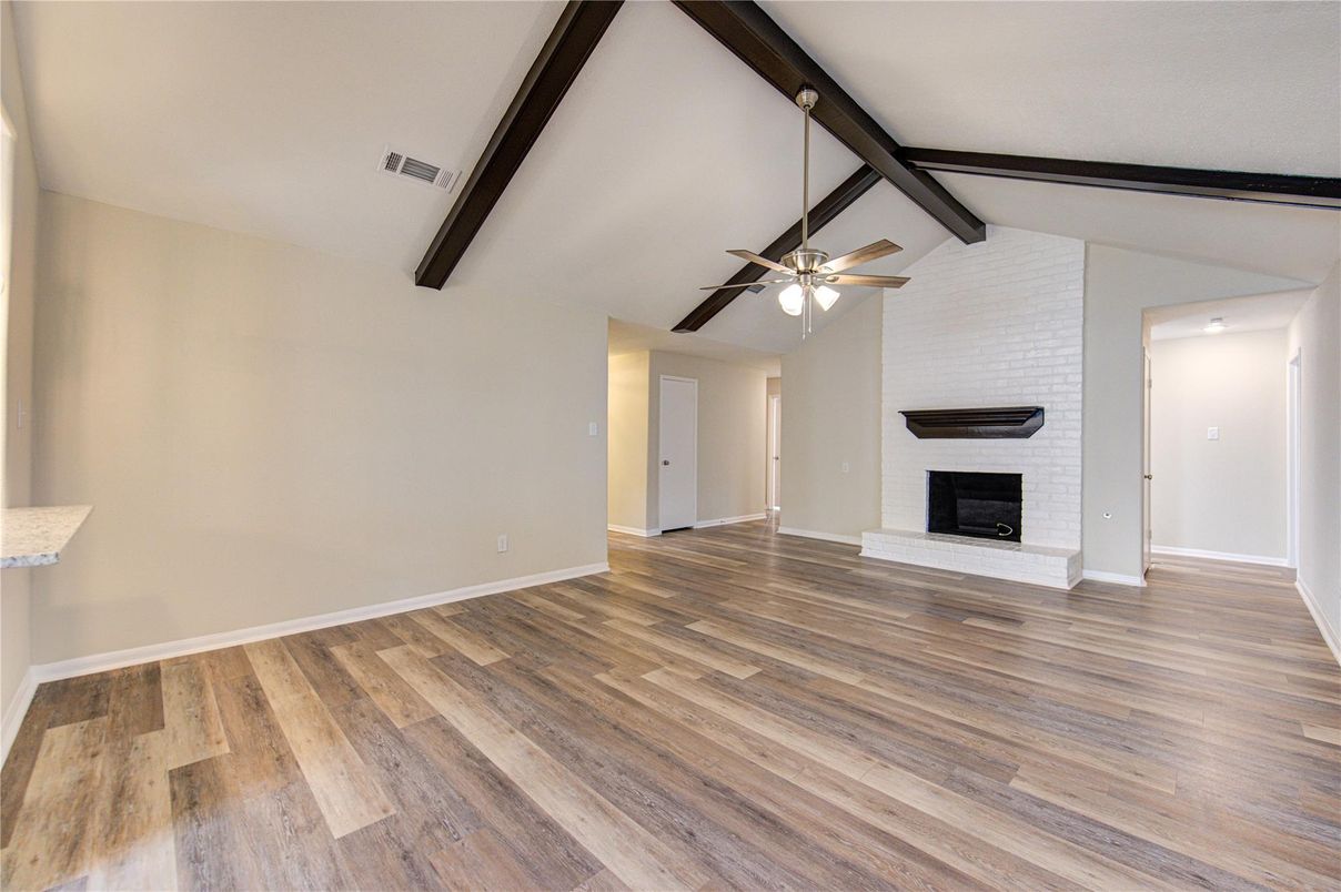 Empty room, Fireplace, Interior, Stone Walls, Wooden Beams, Wood Texture Flooring