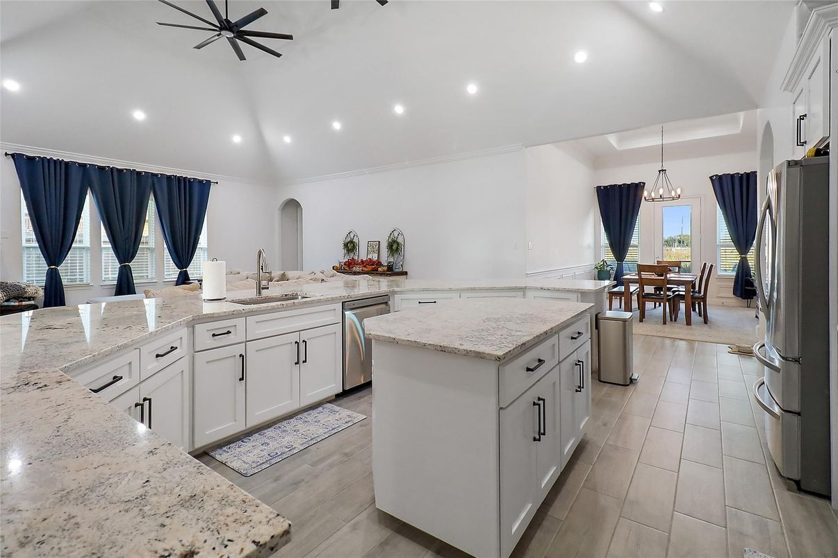 Chandelier, Dining room, Interior, Kitchen, Pendant Lights, Recessed Lighting, Stainless Steel Appliances, Wood Texture Flooring