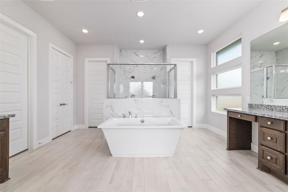 Bathroom, Free Standing Baths, Glass Shower, Interior, Marble Walls, Recessed Lighting, Wood Texture Flooring