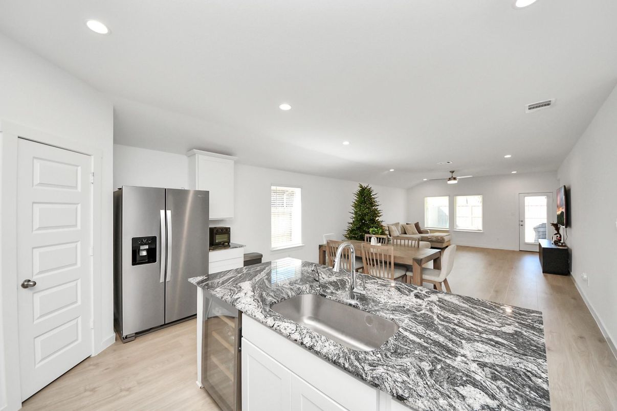 Dining room, Interior, Kitchen, Living room, Recessed Lighting, Stainless Steel Appliances, Wood Texture Flooring