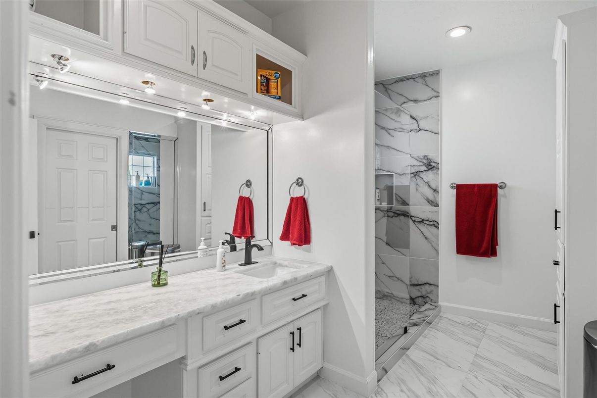 Bathroom, Dual Sink Vanities, Interior, Marble, Marble Walls, Recessed Lighting
