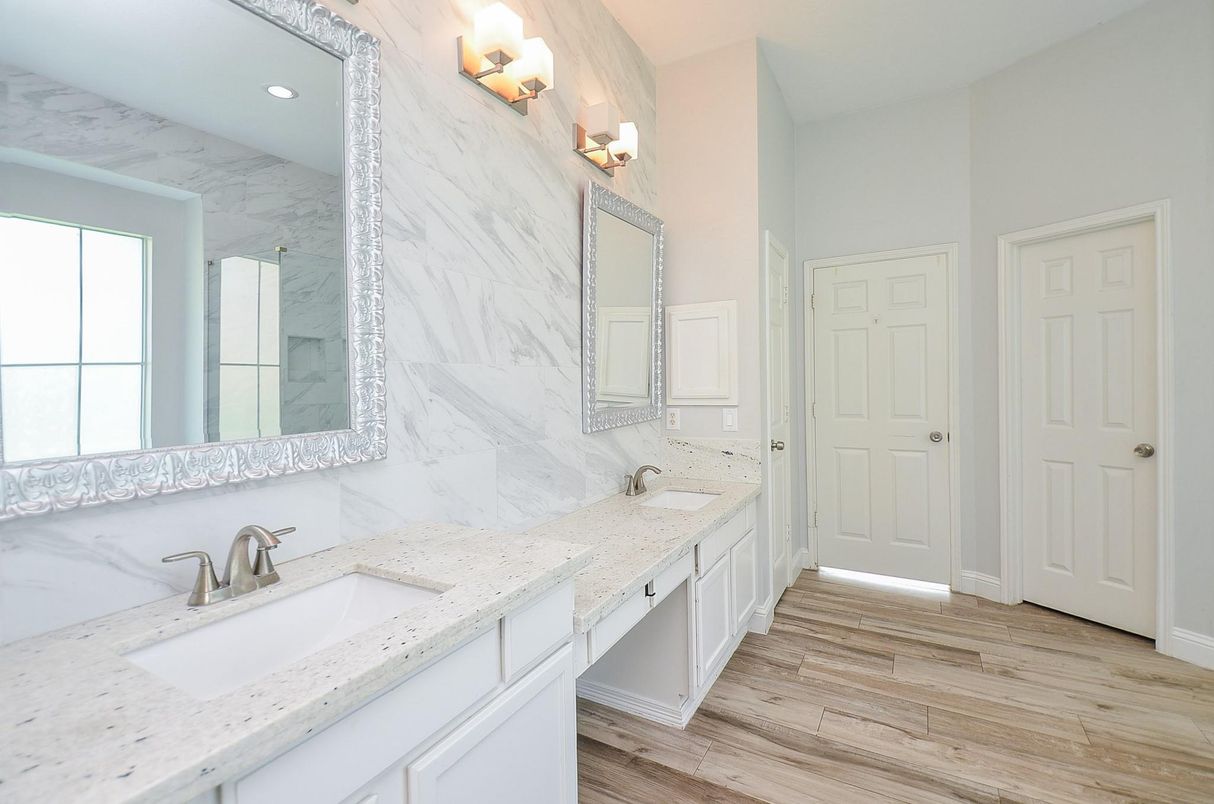 Bathroom, Dual Sink Vanities, Interior, Marble Walls, Recessed Lighting, Wood Texture Flooring