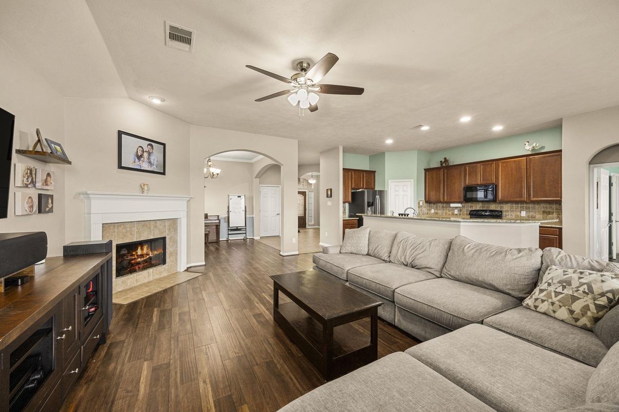 Chandelier, Fireplace, Interior, Kitchen, Living room, Recessed Lighting, Wood Texture Flooring