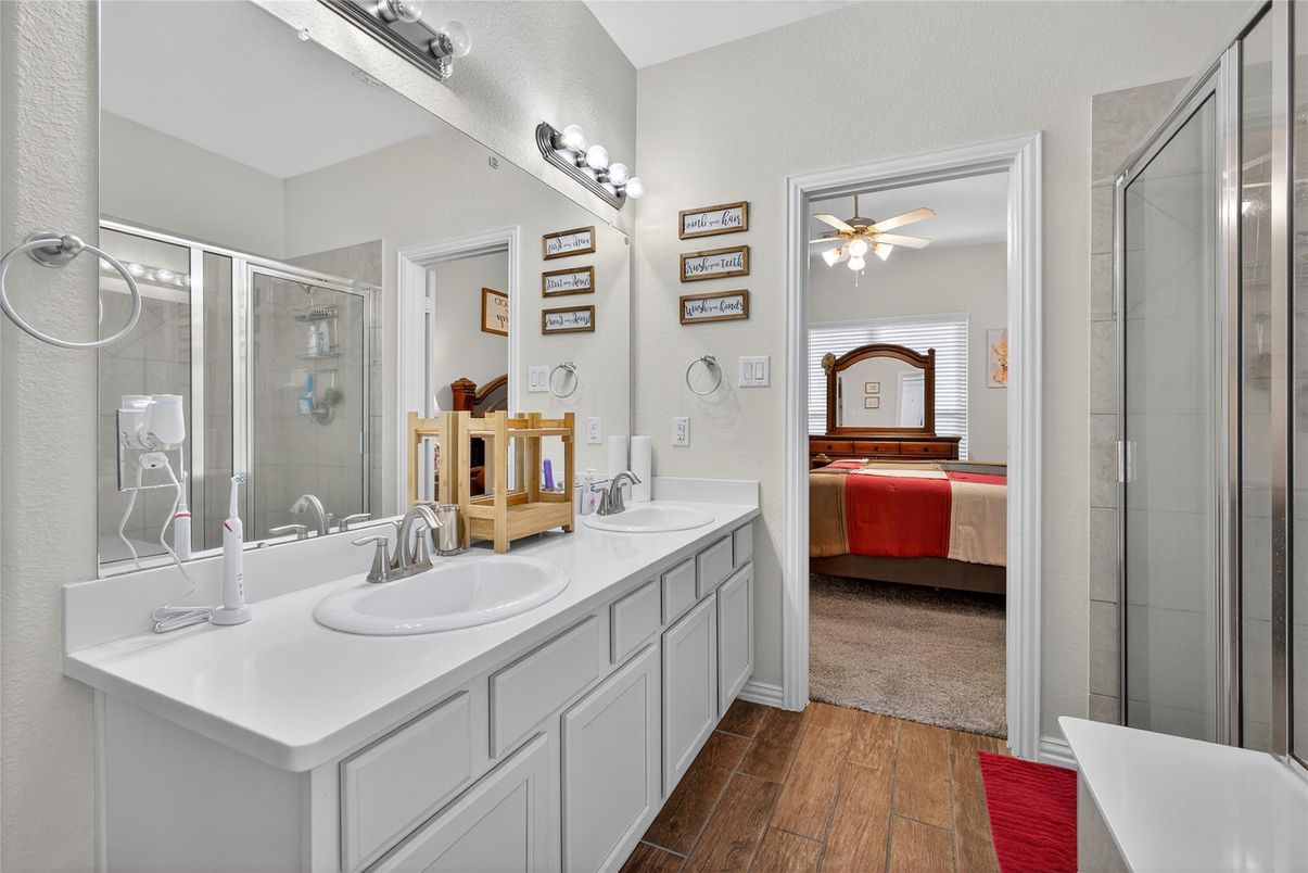 Bathroom, Bedroom, Dual Sink Vanities, Glass Shower, Interior, Wood Texture Flooring
