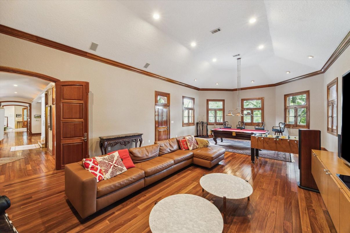 Billiard Table, Fireplace, Game Room, Interior, Living room, Pendant Lights, Recessed Lighting, Wood Texture Flooring