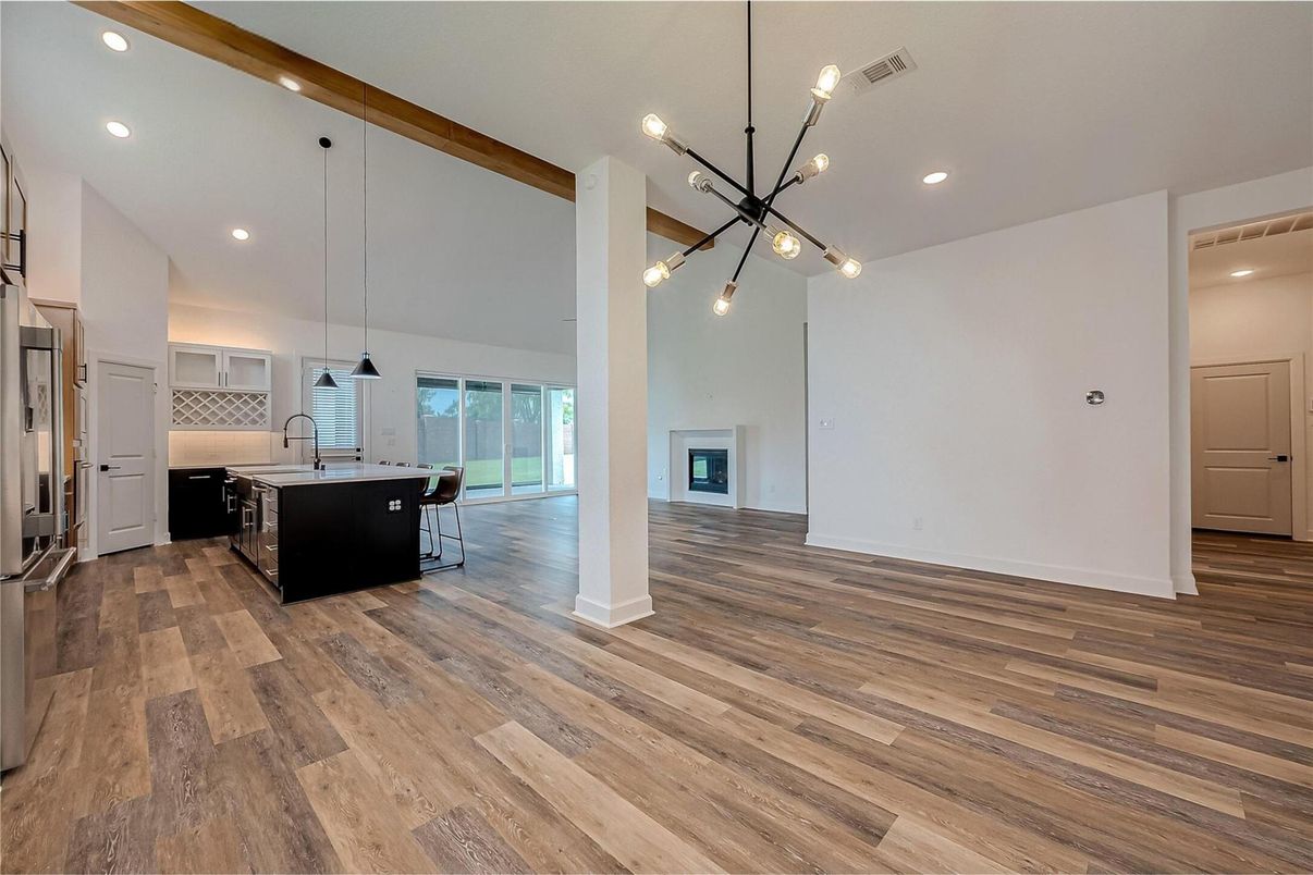 Empty room, Interior, Kitchen, Pendant Lights, Recessed Lighting, Stainless Steel Appliances, Wood Texture Flooring