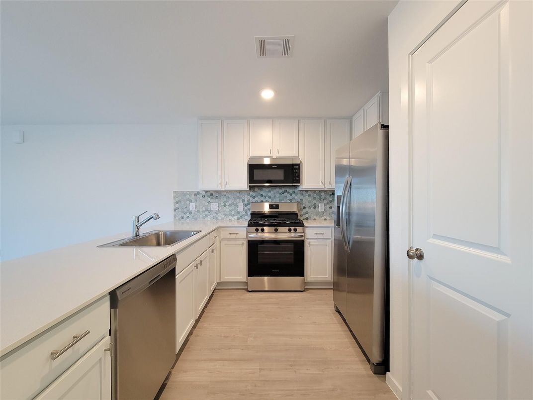 Interior, Kitchen, Recessed Lighting, Stainless Steel Appliances, Wood Texture Flooring