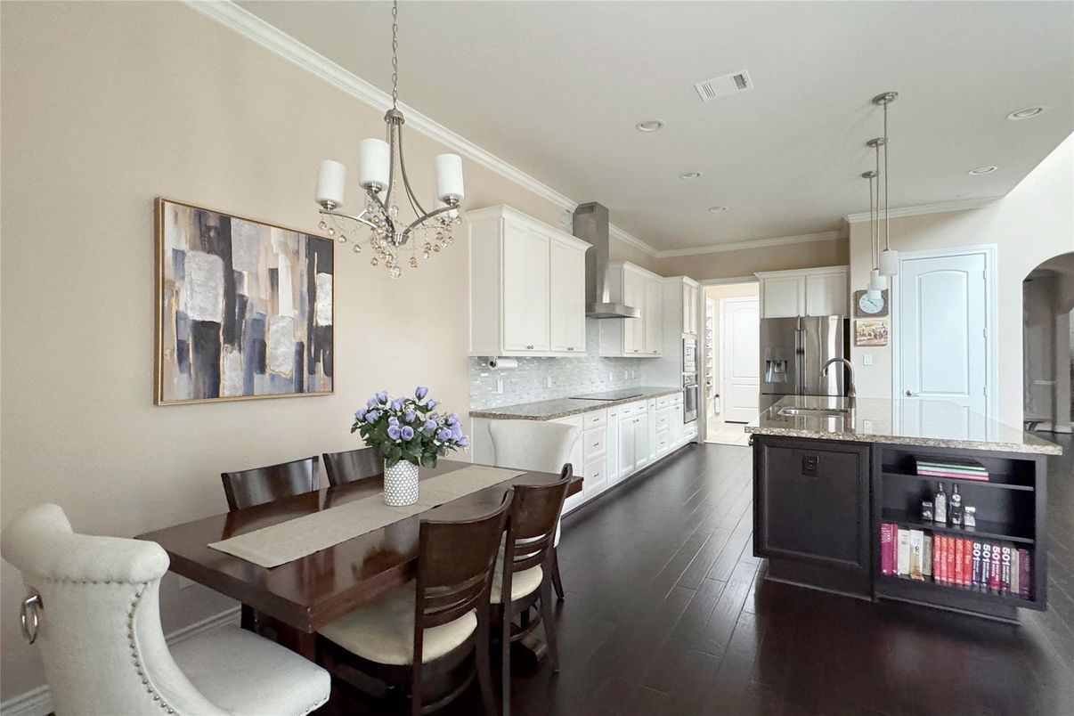 Chandelier, Dining room, Interior, Kitchen, Pendant Lights, Recessed Lighting, Stainless Steel Appliances, Wood Texture Flooring