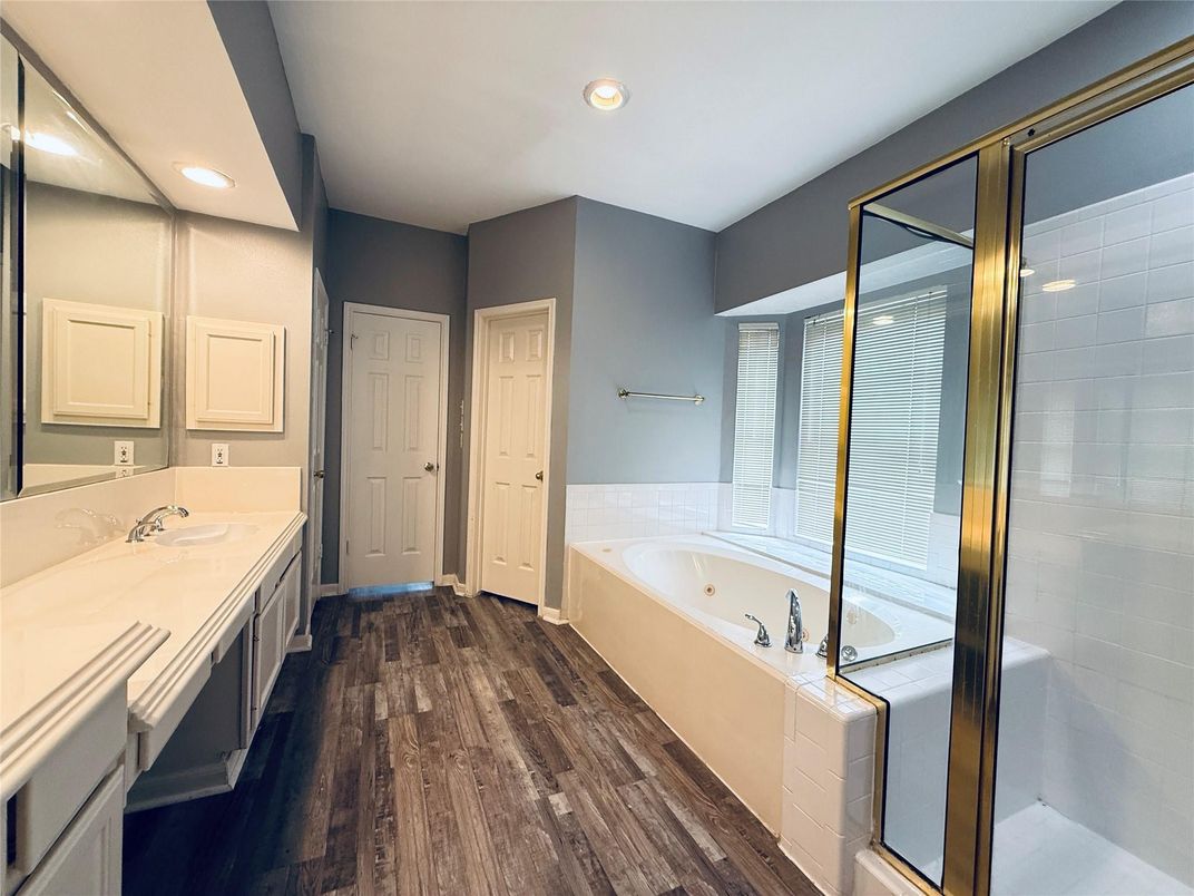 Bathroom, Dual Sink Vanities, Glass Shower, Interior, Recessed Lighting, Wood Texture Flooring