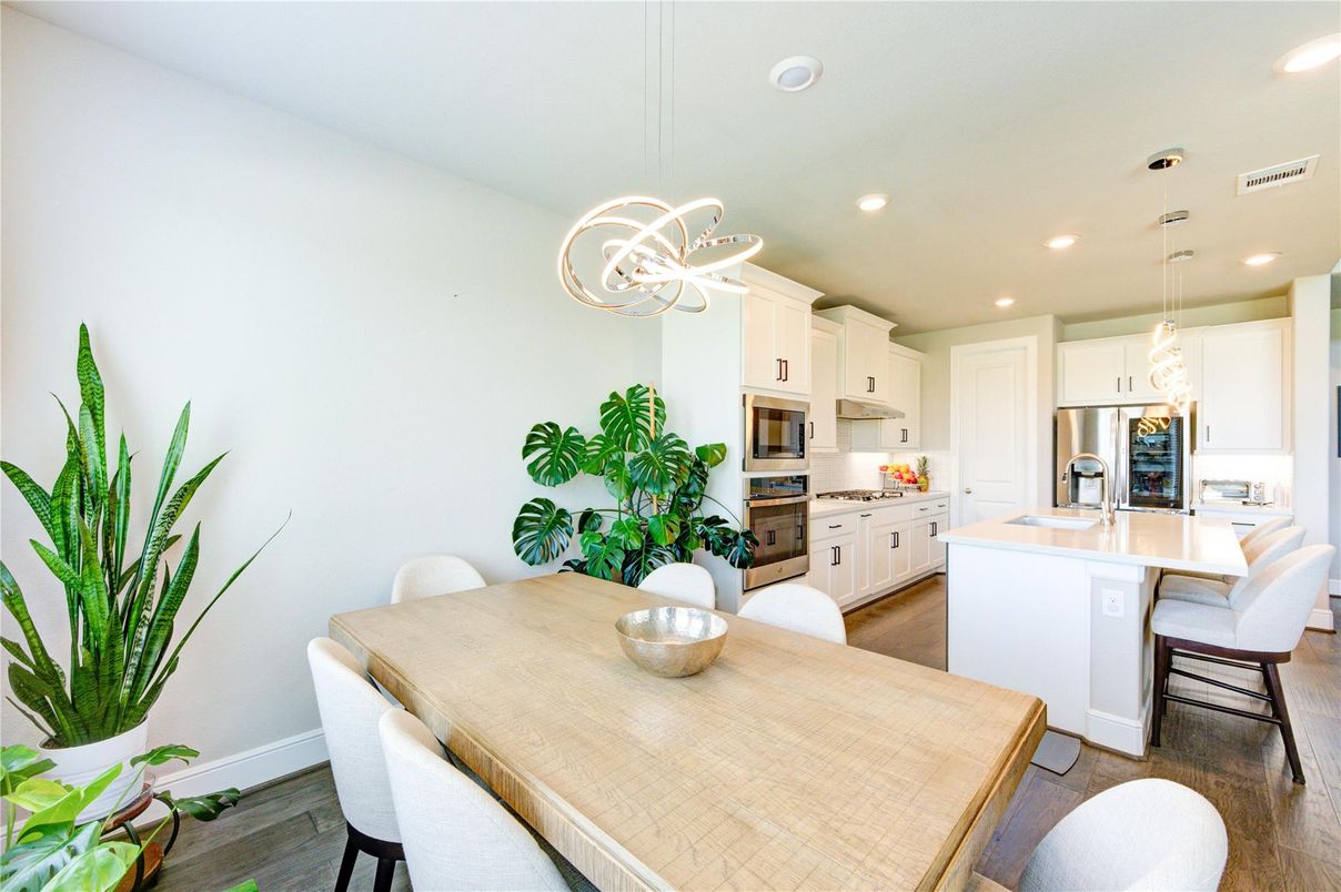 Dining room, Interior, Kitchen, Pendant Lights, Recessed Lighting, Stainless Steel Appliances, Wood Texture Flooring