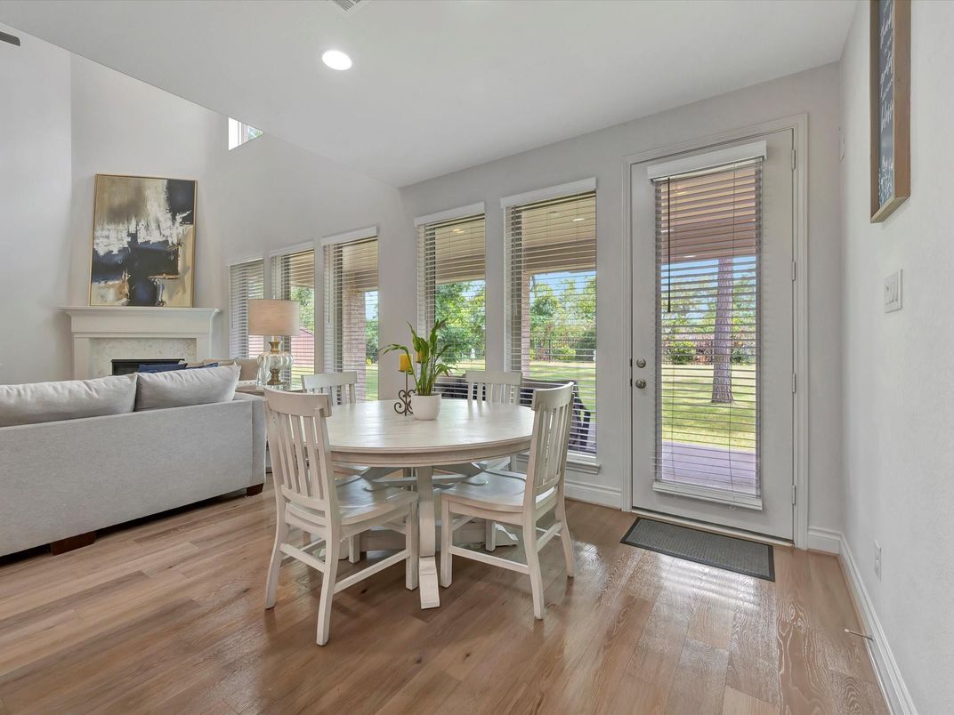 Dining room, Fireplace, Interior, Living room, Recessed Lighting, Wood Texture Flooring