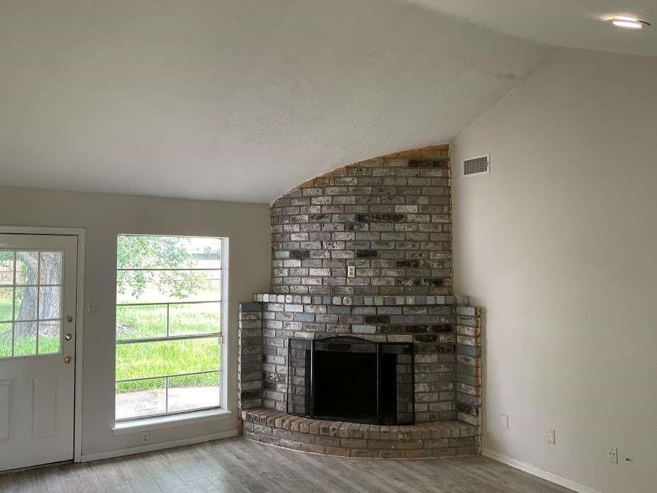 Empty room, Fireplace, Interior, Recessed Lighting, Stone Walls, Wood Texture Flooring