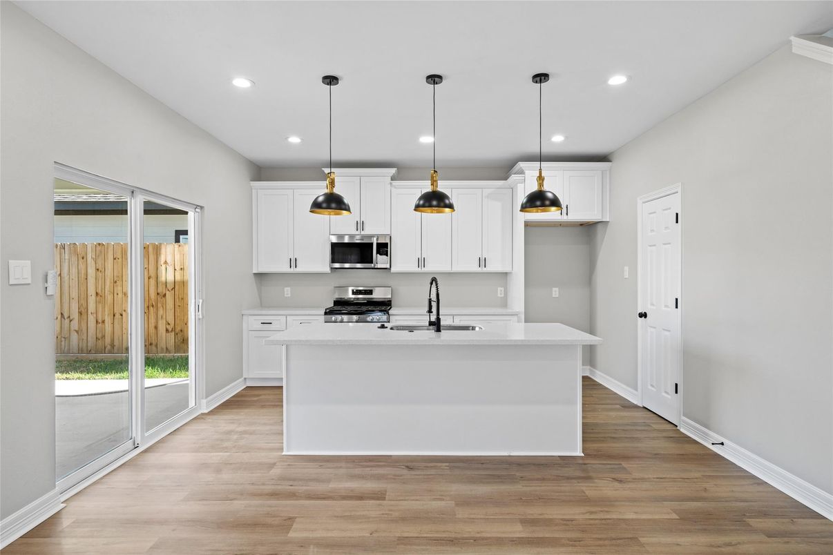 Interior, Kitchen, Pendant Lights, Recessed Lighting, Stainless Steel Appliances, Wood Texture Flooring