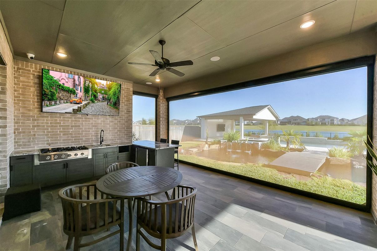 Dining room, Interior, Kitchen, Recessed Lighting, Stainless Steel Appliances, Stone Walls, Wood Texture Flooring
