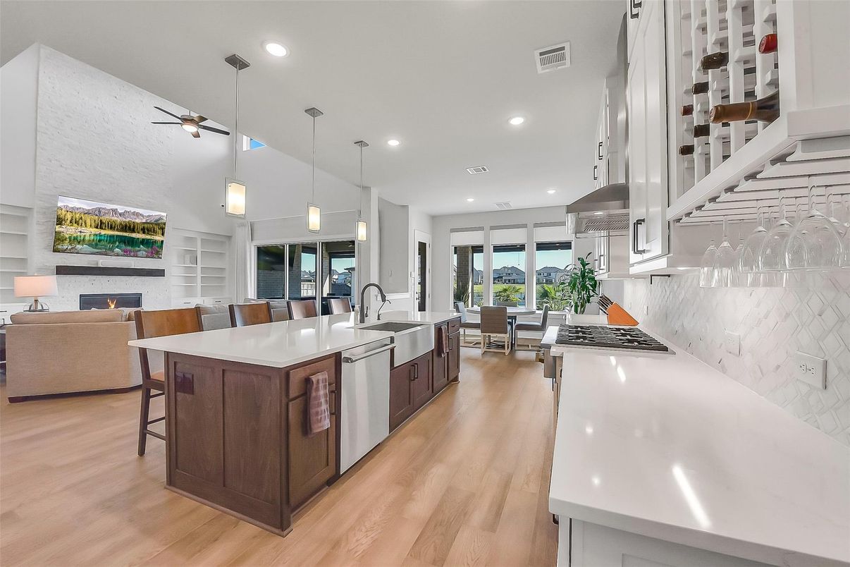 Dining room, Fireplace, Interior, Kitchen, Living room, Pendant Lights, Recessed Lighting, Stainless Steel Appliances, Wood Texture Flooring