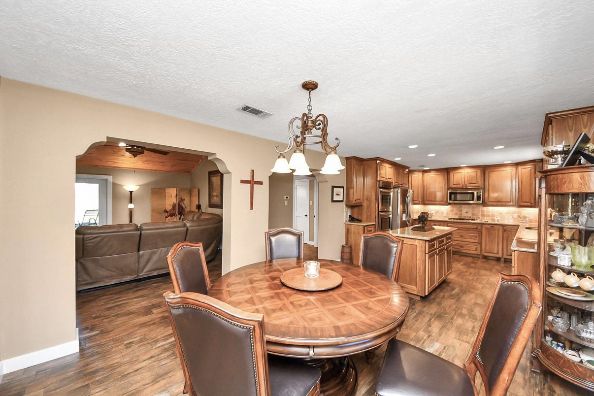 Chandelier, Dining room, Interior, Kitchen, Living room, Recessed Lighting, Stainless Steel Appliances, Wood Texture Flooring