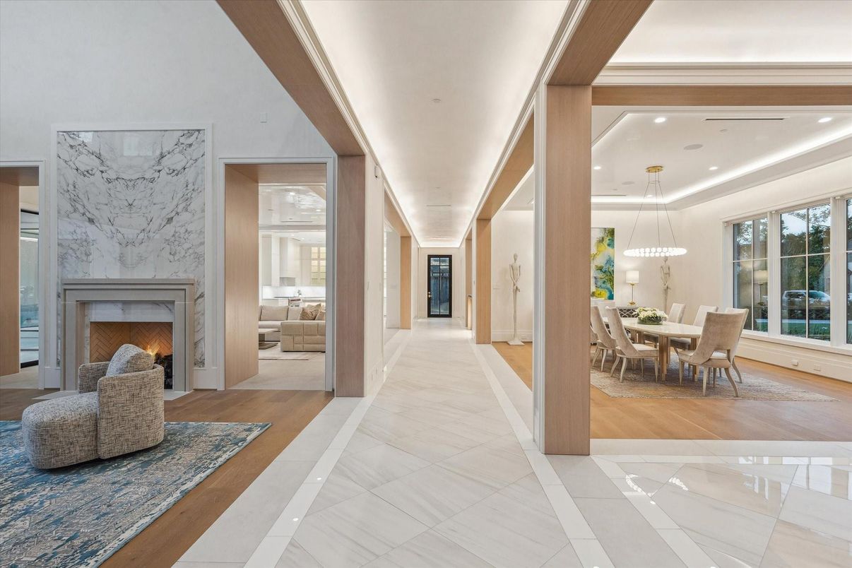 Chandelier, Dining room, Fireplace, Interior, Marble Walls, Pendant Lights, Recessed Lighting, Wood Texture Flooring