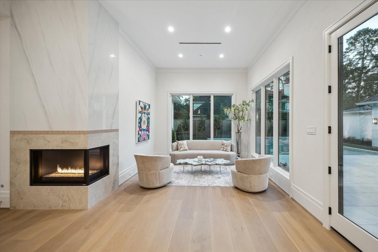 Fireplace, Interior, Living room, Marble Walls, Recessed Lighting, Wood Texture Flooring