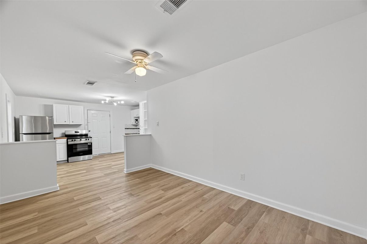 Empty room, Interior, Kitchen, Stainless Steel Appliances, Wood Texture Flooring