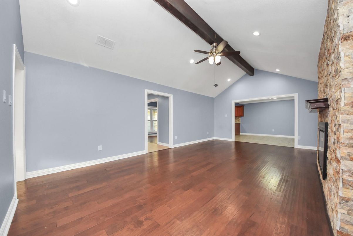 Empty room, Fireplace, Interior, Recessed Lighting, Stone Walls, Wood Texture Flooring