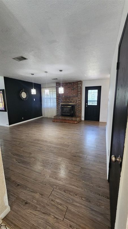 Empty room, Fireplace, Interior, Pendant Lights, Stone Walls, Wood Texture Flooring