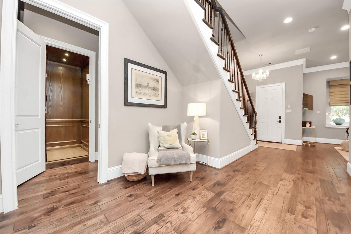 Chandelier, Elevator, Interior, Recessed Lighting, Wood Texture Flooring, Wooden Walls
