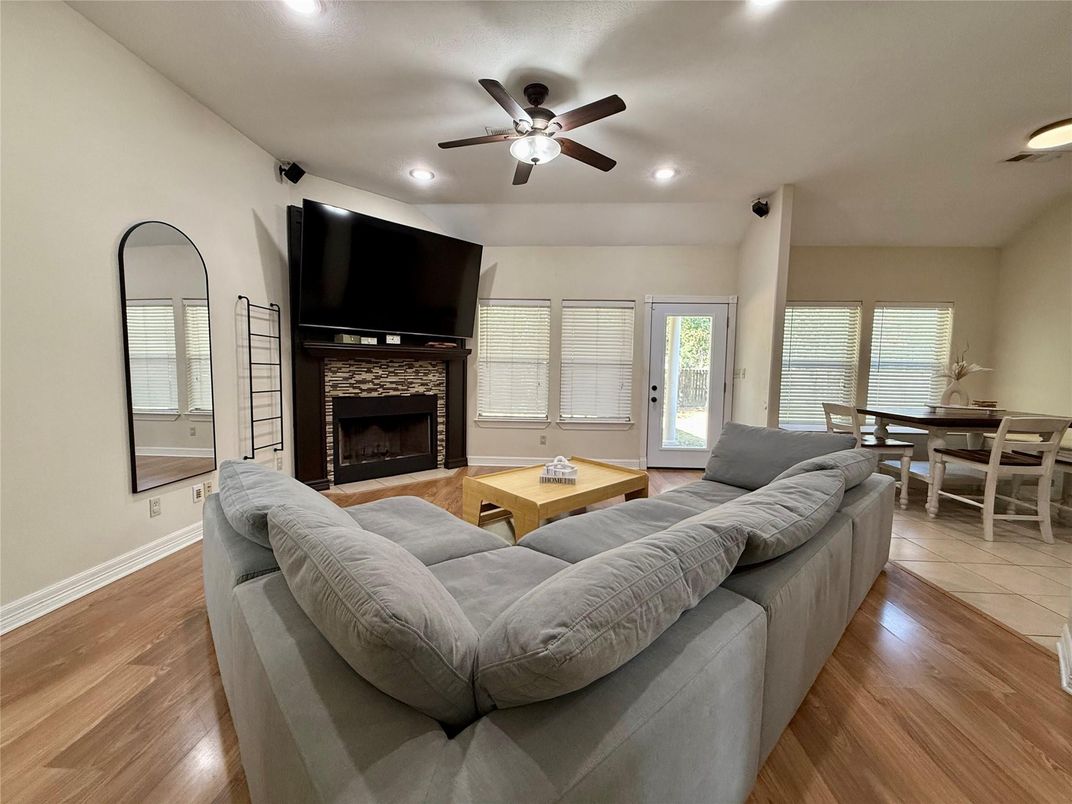 Dining room, Fireplace, Interior, Living room, Recessed Lighting, Wood Texture Flooring