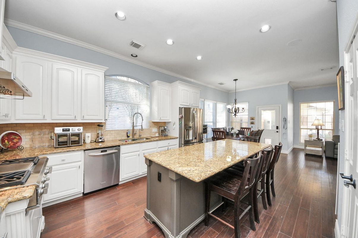 Dining room, Interior, Kitchen, Pendant Lights, Recessed Lighting, Stainless Steel Appliances, Wood Texture Flooring