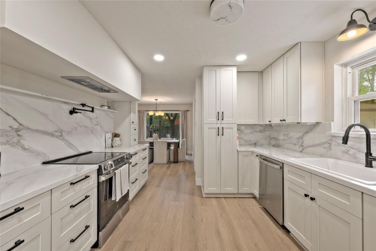Interior, Kitchen, Marble Walls, Recessed Lighting, Stainless Steel Appliances, Wood Texture Flooring
