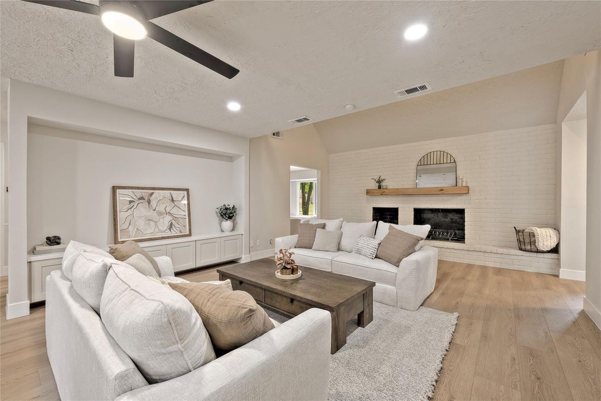 Fireplace, Interior, Living room, Recessed Lighting, Stone Walls, Wood Texture Flooring