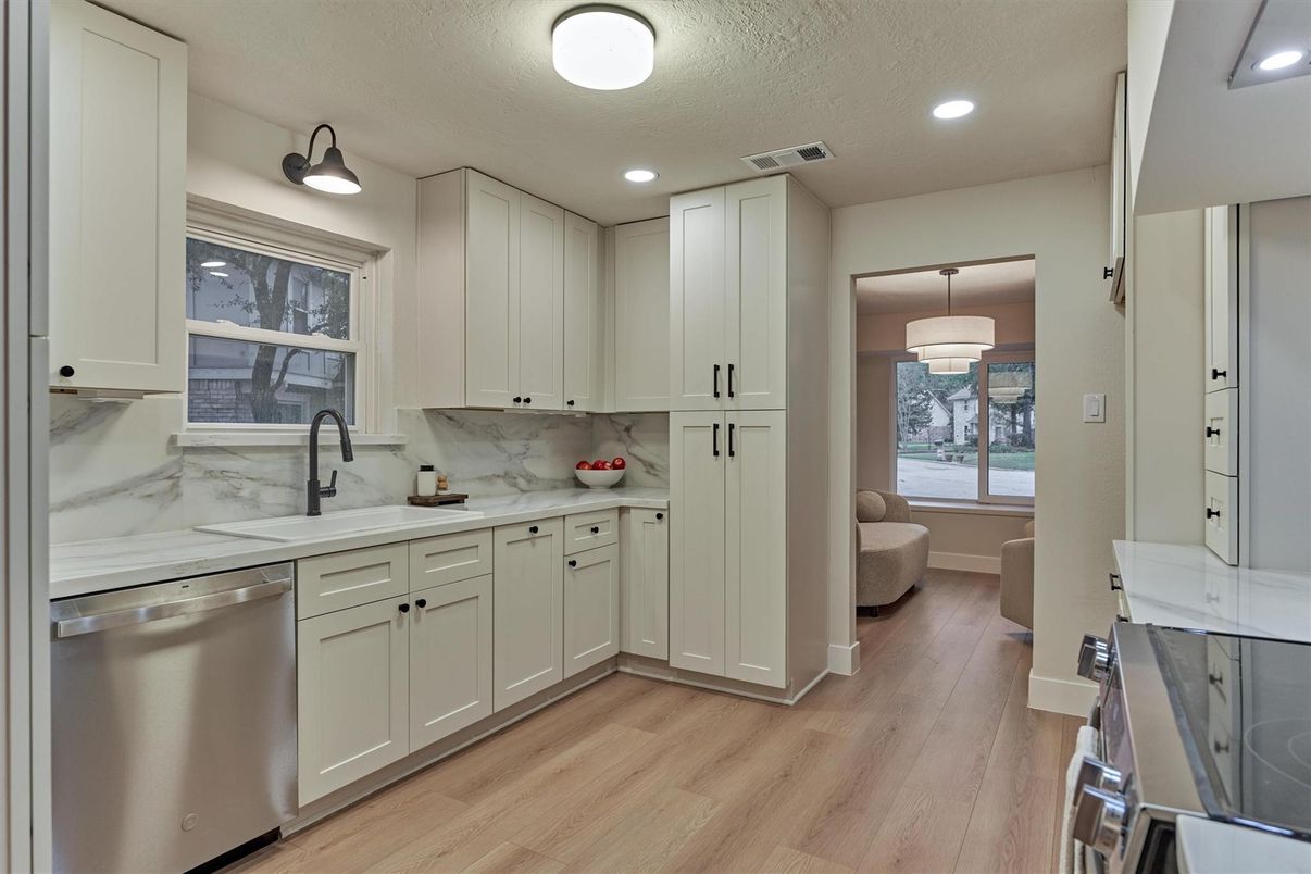 Interior, Kitchen, Marble Walls, Recessed Lighting, Stainless Steel Appliances, Wood Texture Flooring