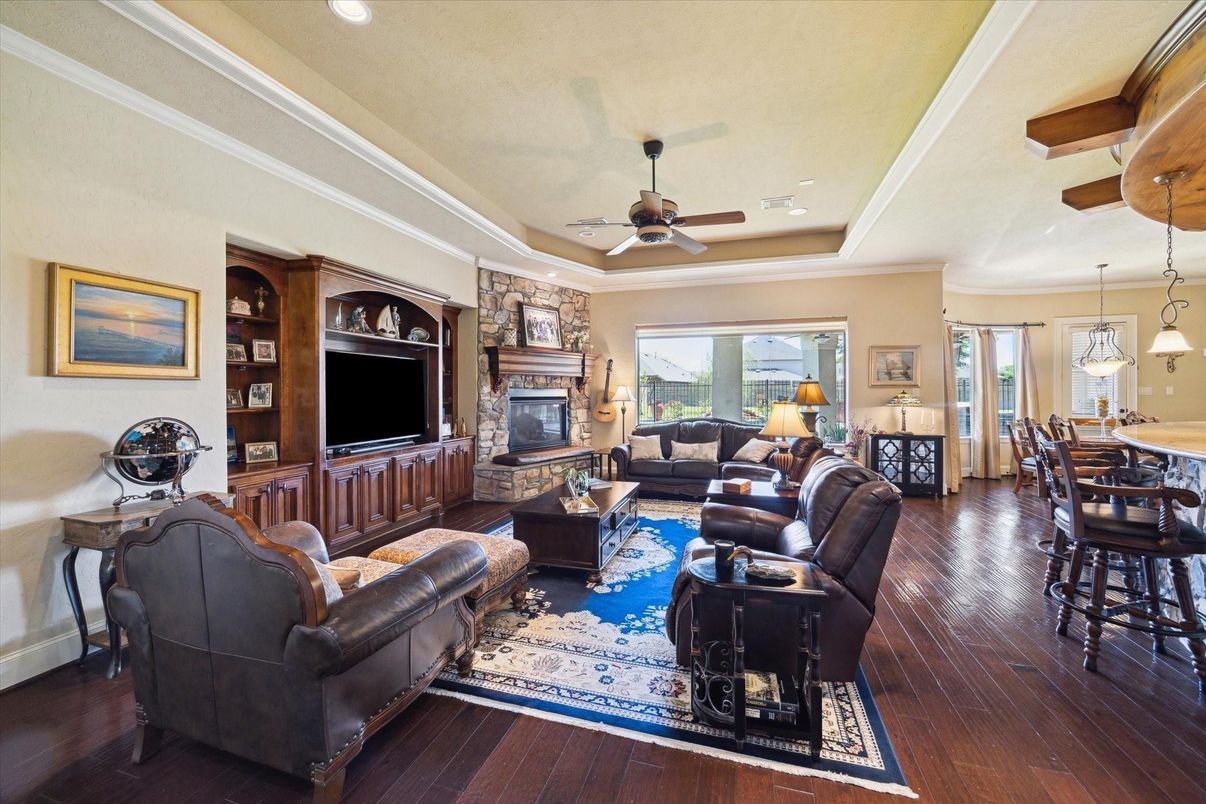 Dining room, Fireplace, Interior, Living room, Pendant Lights, Recessed Lighting, Wood Texture Flooring