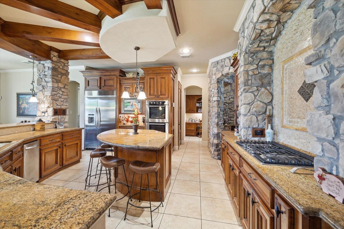 Fireplace, Interior, Kitchen, Pendant Lights, Recessed Lighting, Stainless Steel Appliances, Stone Walls, Wooden Beams