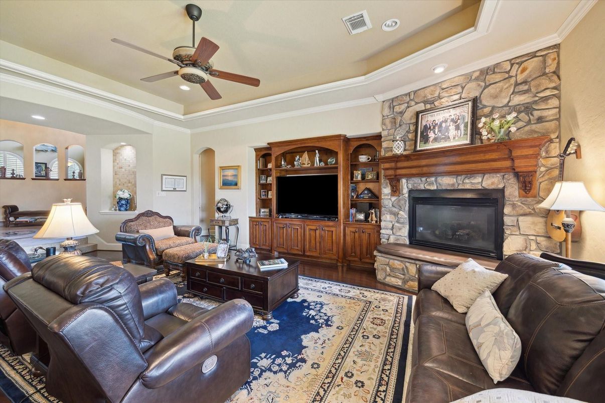 Fireplace, Interior, Living room, Recessed Lighting, Stone Walls, Wood Texture Flooring