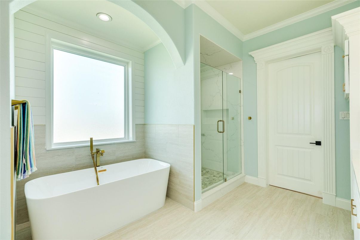 Bathroom, Free Standing Baths, Glass Shower, Interior, Marble Walls, Recessed Lighting, Wood Texture Flooring