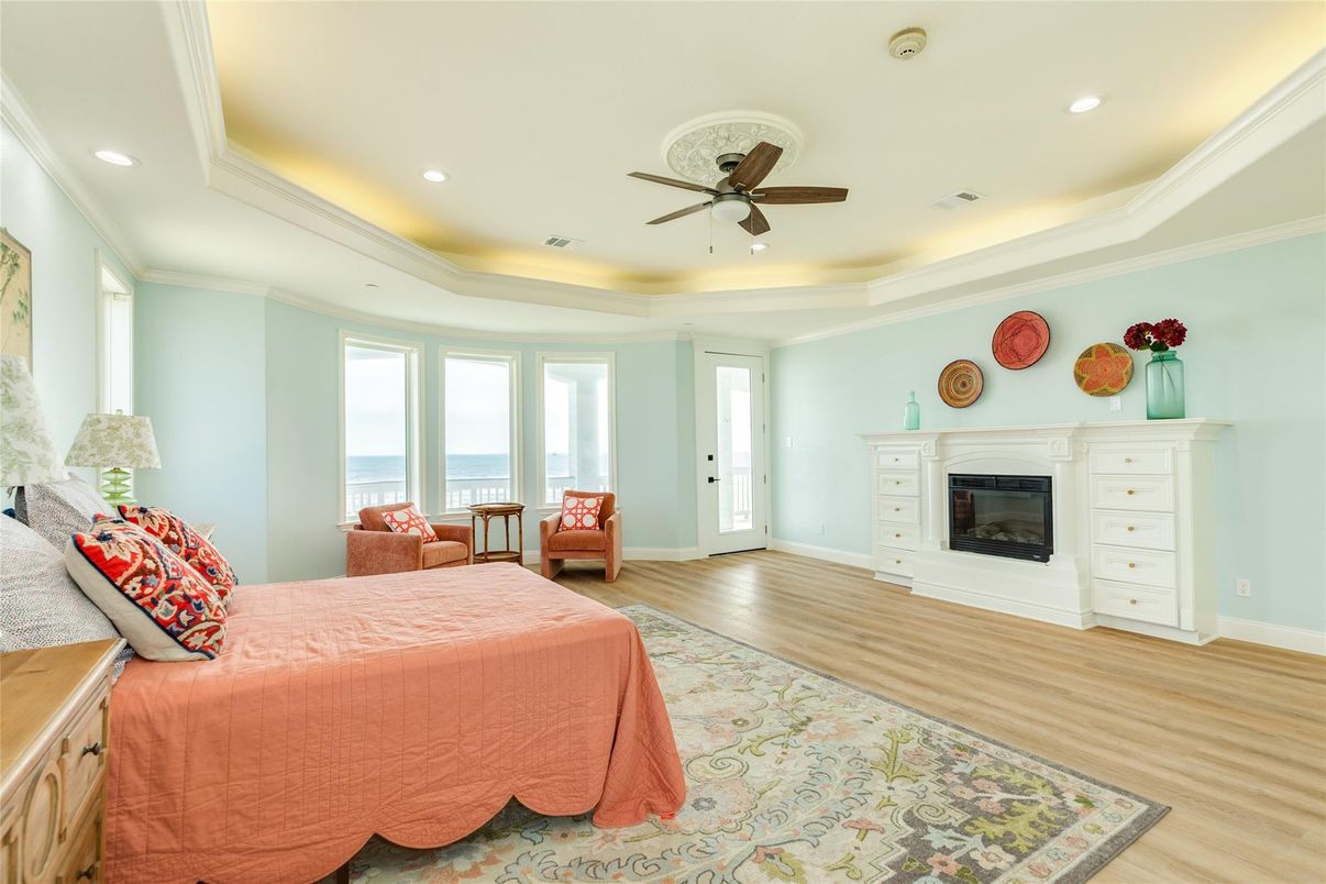 Bedroom, Fireplace, Interior, Recessed Lighting, Water, Wood Texture Flooring