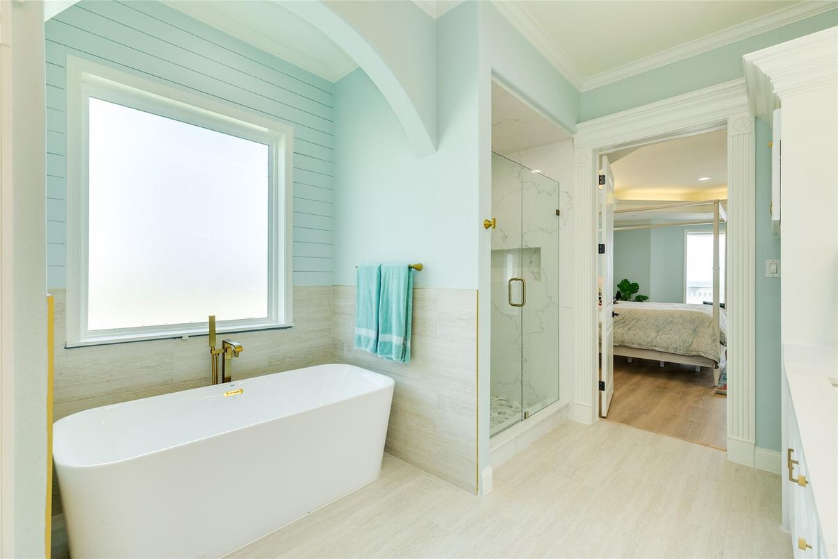 Bathroom, Free Standing Baths, Glass Shower, Interior, Marble Walls, Recessed Lighting, Wood Texture Flooring