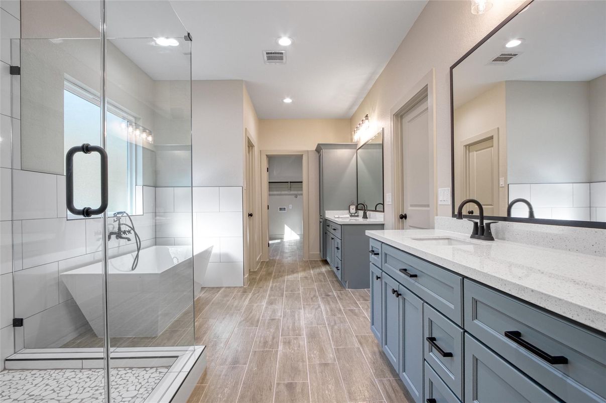 Bathroom, Dual Sink Vanities, Free Standing Baths, Glass Shower, Interior, Recessed Lighting, Wood Texture Flooring