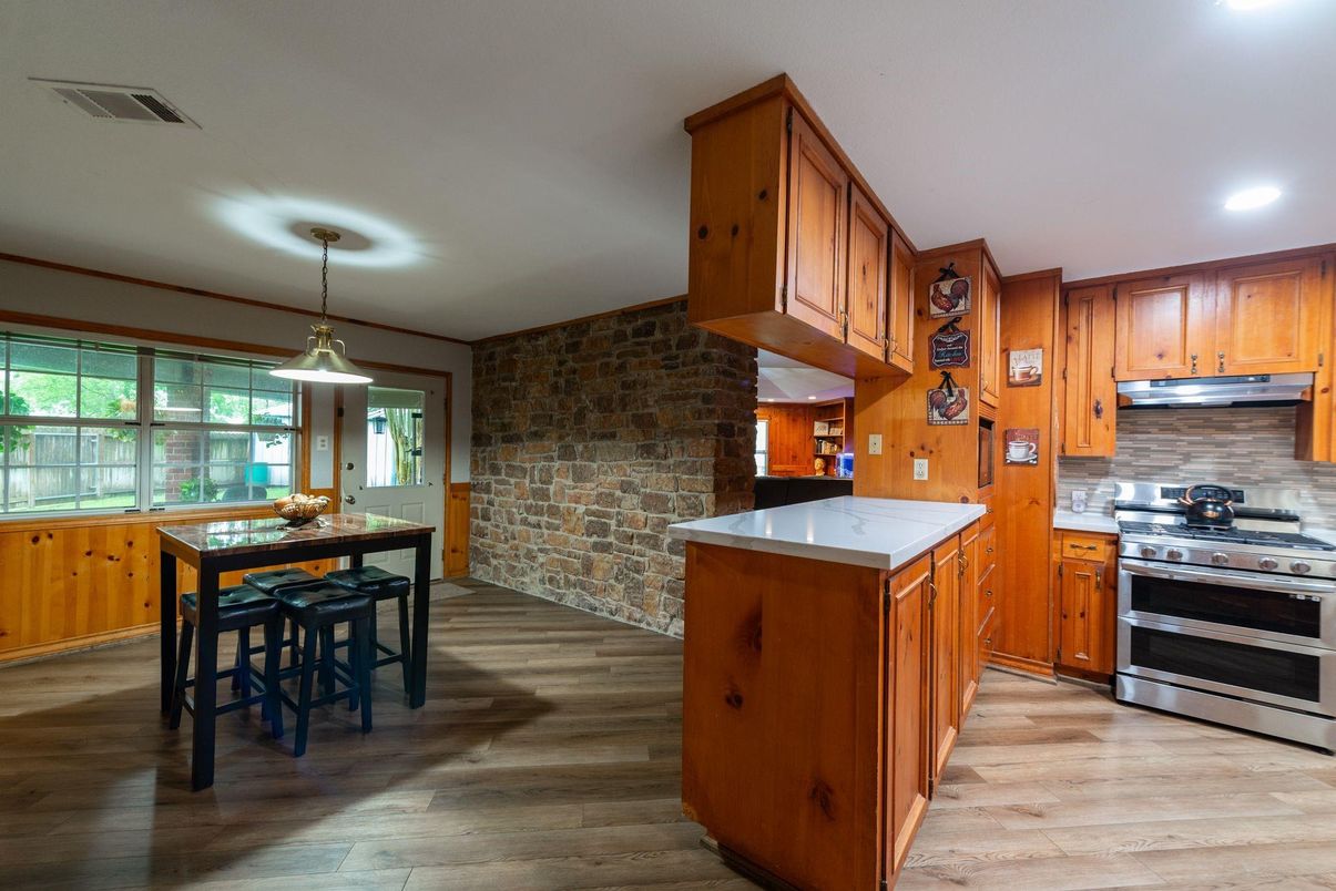 Interior, Kitchen, Pendant Lights, Recessed Lighting, Stainless Steel Appliances, Stone Walls, Wood Texture Flooring