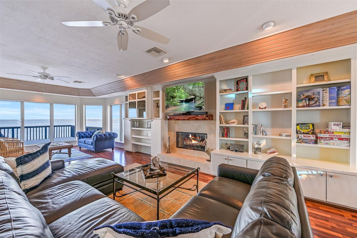 Fireplace, Interior, Living room, Recessed Lighting, Water, Wood Texture Flooring